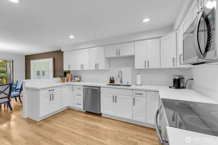 Stainless gallery appliances and custom handles.