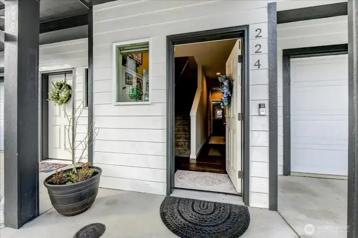 Entry is on the lower level and has a hallway that leads to the garage, 3/4 bath and bedroom w/yard access.