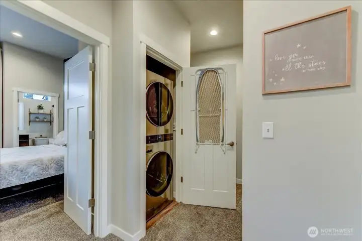 Upstairs laundry closet is nestled between bedrooms and baths and makes it super convenient to do laundry.