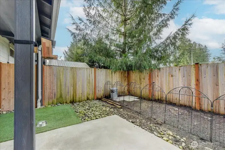 Fenced backyard with patio is great feature, and it backs to a green belt/retention pond area.