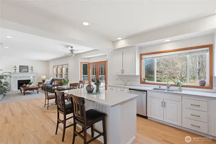 Spacious open Kitchen, breakfast bar, with French Door access to the backyard and deck - Great for entertaining!