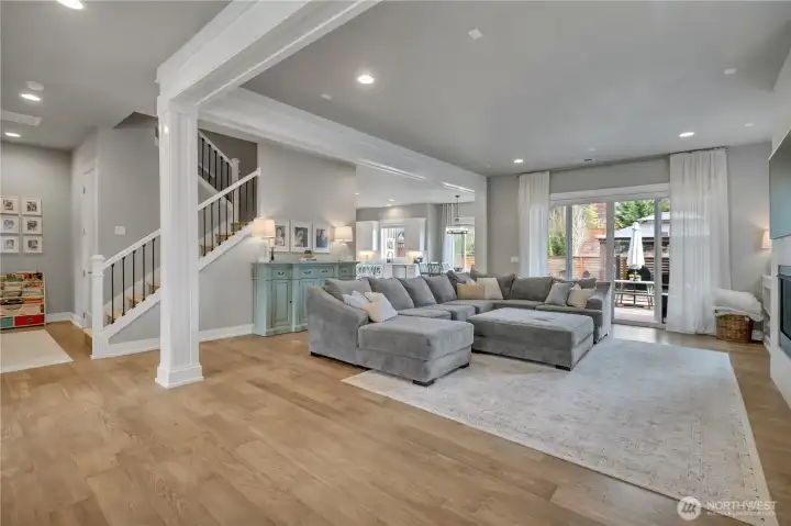 Main floor open-concept design ideal for seamless living and entertaining. Sliding doors open to extended covered outdoor living space.