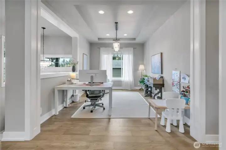 Formal dining area currently used as a flexible work and play space. Formal dining area currently used as a flexible work and play space.