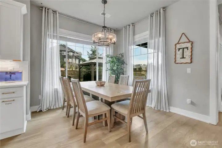 Dining area off the kitchen providing a natural transition between cooking and entertaining spaces. Dining area off the kitchen providing a natural transition between cooking and entertaining spaces.