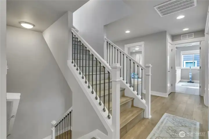 Upper landing with stairs to rooftop deck.