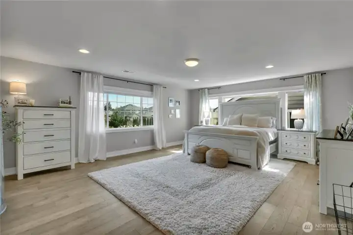 Grand primary suite with generous proportions and natural light.