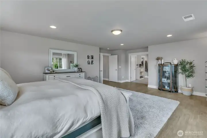 The primary bedroom is a peaceful setting for rest and relaxation.