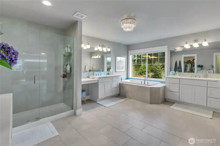 Five-piece primary bathroom with spa-like layout. Five-piece primary bathroom with spa-like layout.