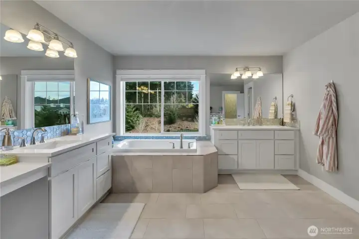 Dual vanities in the primary bath for added convenience. Dual vanities in the primary bath for added convenience.