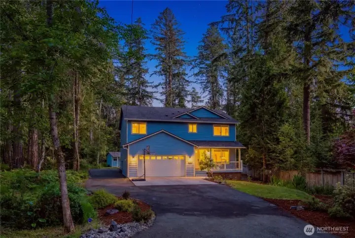 Evening exterior showcasing peaceful setting and architectural details.