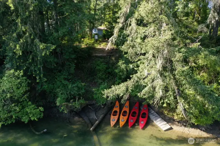 Private shoreline access with kayaks ready for Puget Sound adventures.
