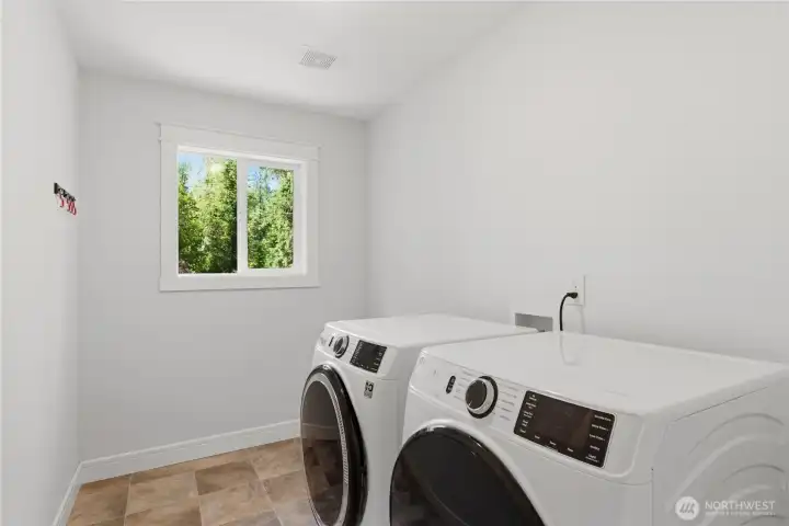 Dedicated laundry room with additional storage space