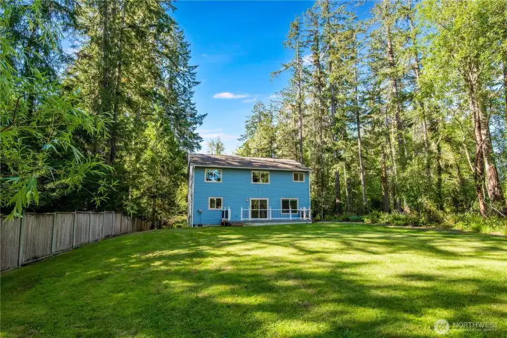 Large backyard offering privacy and outdoor recreation space.