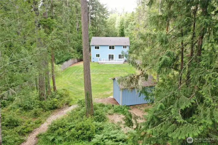 Large backyard offering privacy and outdoor recreation space. Large backyard offering privacy and outdoor recreation space.