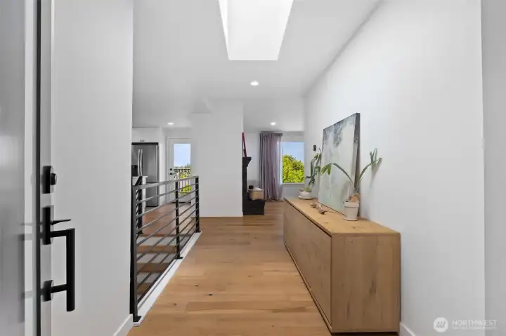 Large entryway with skylight. Powder room just to the left. Large entryway with skylight. Powder room just to the left.