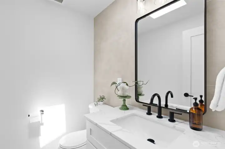 Powder room with skylight. Powder room with skylight.