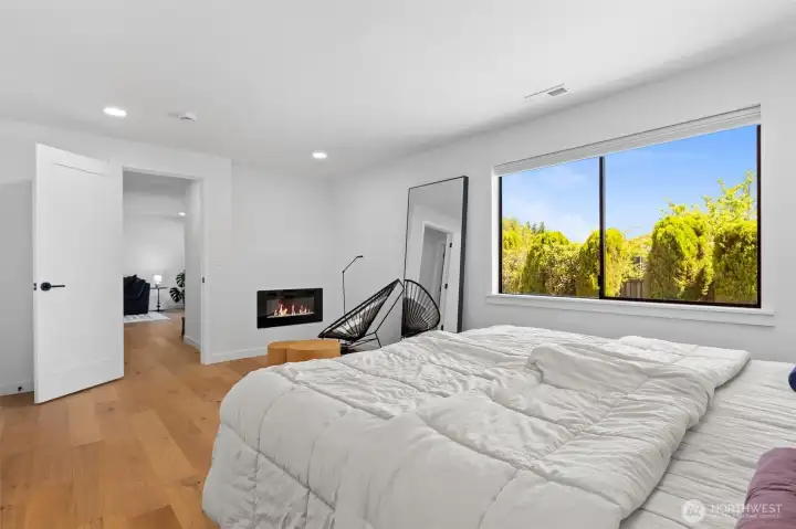 Primary suite! Extra large room fits a King sized bed with room for a seating area by the electric fireplace. Primary suite! Extra large room fits a King sized bed with room for a seating area by the electric fireplace.