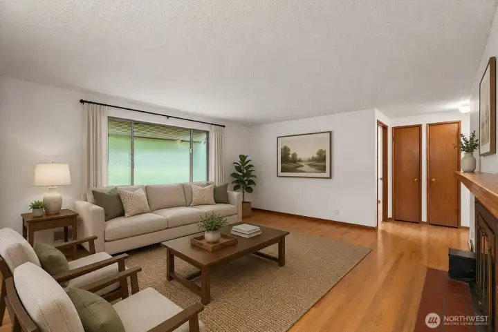 Large windows, original details, and an open feel make this living room a space that's ready to enjoy today while offering plenty of opportunity to make it your own.