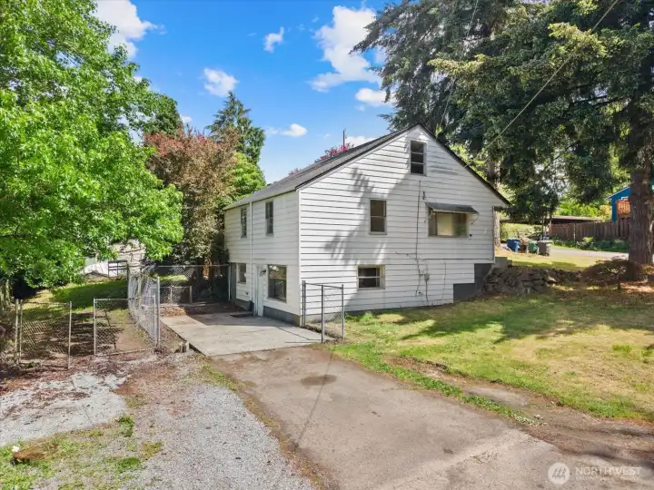 The backyard offers a surprising amount of usable space, with room to garden, entertain, play, or simply enjoy the peaceful surroundings.