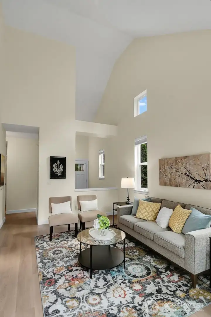 The soaring 9-foot ceilings enhance the sense of space, creating an open, bright, and airy atmosphere throughout the room.