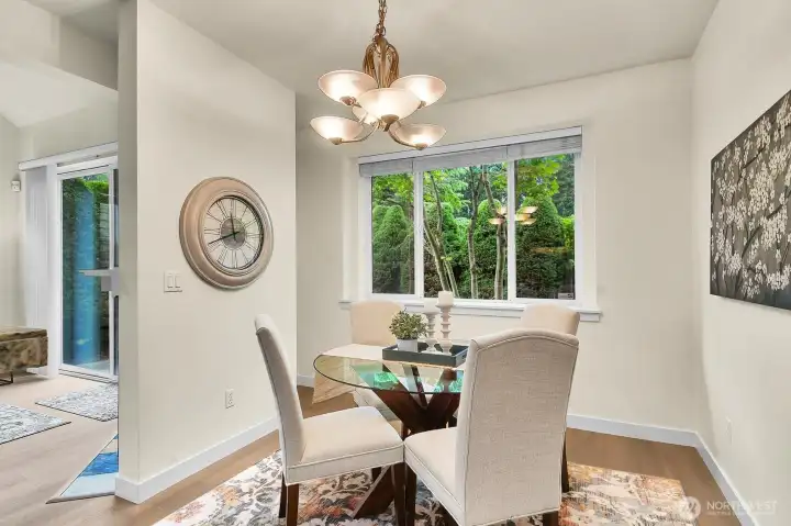 Filled with natural light, this inviting eating area creates a warm and comfortable setting for everyday meals.