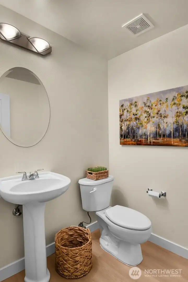 A conveniently located powder room is perfect for guests and everyday living.