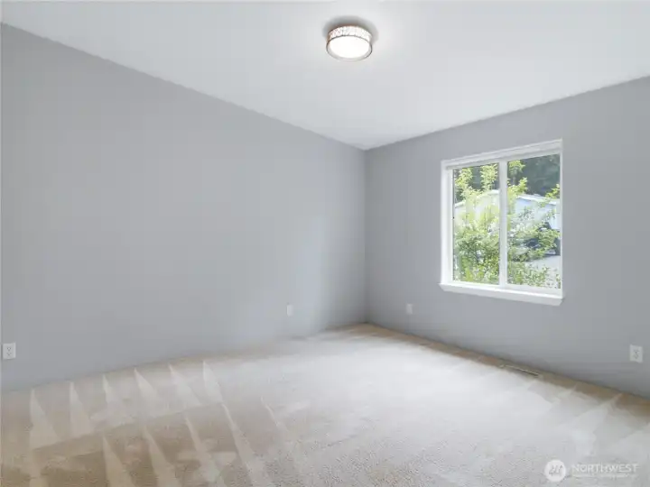 Primary bedroom, nice view of your garden.
