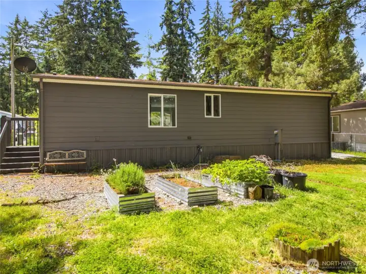 Back view of the house with the garden beds