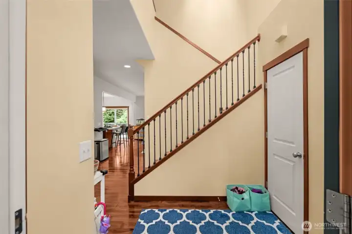 True entry with exterior door and garage door.