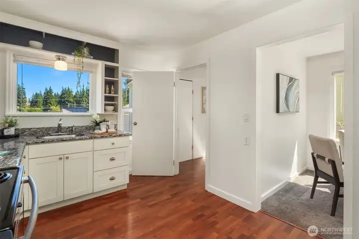 Kitchen flows into laundry/mudroom area & dining room.
