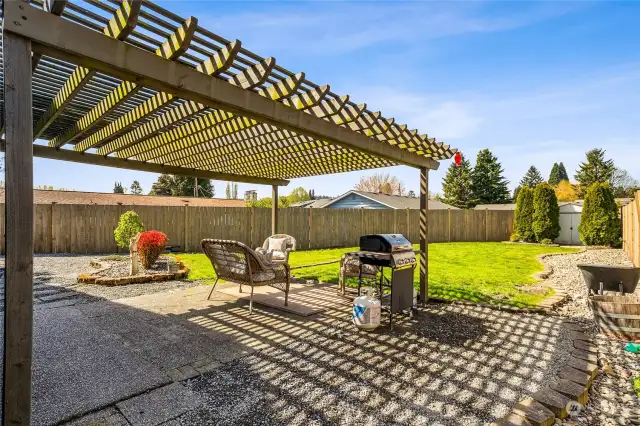 The private fenced backyard beckons play, pets, and parties. A detached shed provides space for all your "extras".