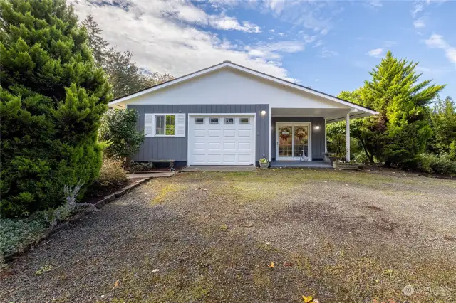 New exterior paint on part of the home gives the home a fresh look that invites you in.