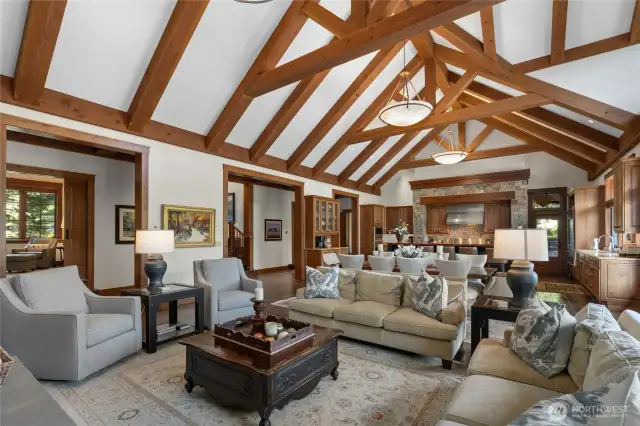 Open concept living between great room, dining, and kitchen