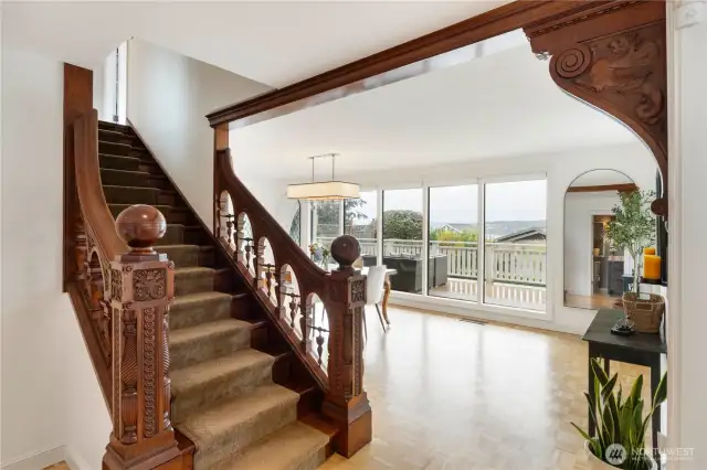 The stunning banister & woodwork from the Old Tacoma Hotel is a true showpiece and leads to the spacious dining room with more beautiful views
