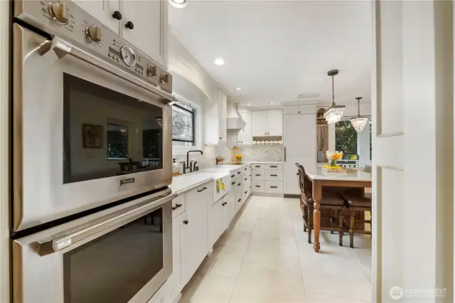 Bake pizza and cookies at the same time for your next party and there is a beverage/wine storage rack as well