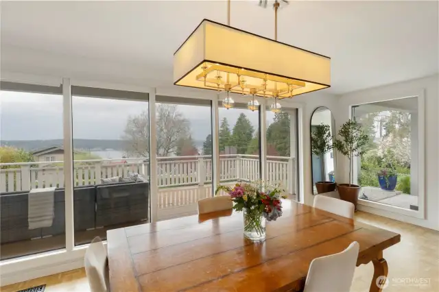 There is space in the formal dining area for a huge table and your can entertain indoors and out from the view deck or adjacent covered dining area