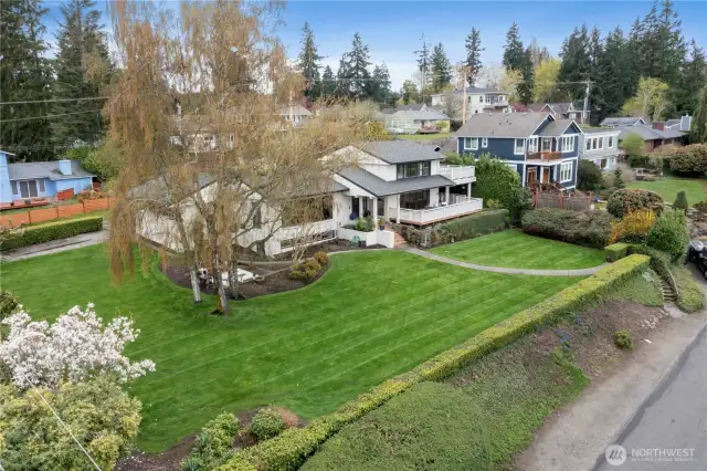 Nestled on the corner lot of a shy half acre of rolling lawn & established landscaping, people & pets can play, relax  & roam the grounds. There is also space to add a detached garage/shop or additional dwelling. *Parties to verify all information to your satisfaction
