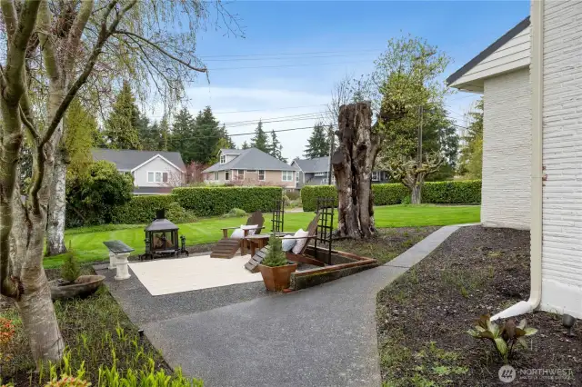 Relax by the fire, roast some marshmallows and enjoy the views in one of the many outdoor spaces on this sprawling property. There is also a sprinkler system for the lawn, so maintenance is easy