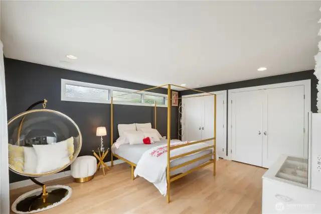 The roomy main level suite offers hardwood floors and double closets with cedar organizers
