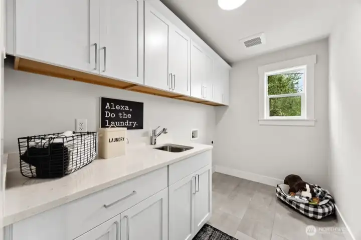 Laundry room with plenty of storage.