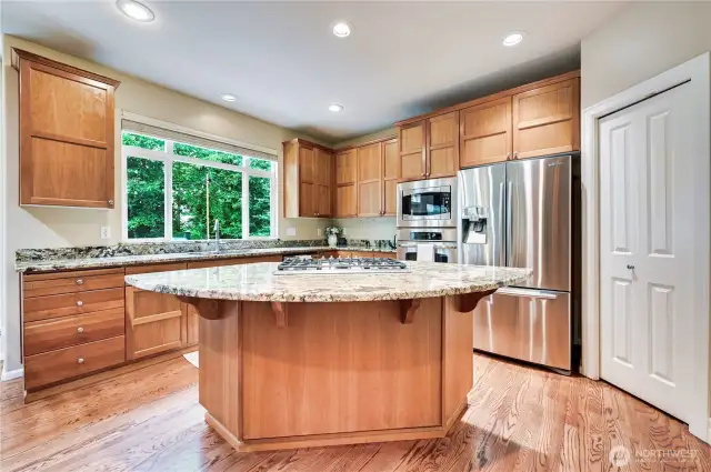 Large open kitchen with island and stainless appliances