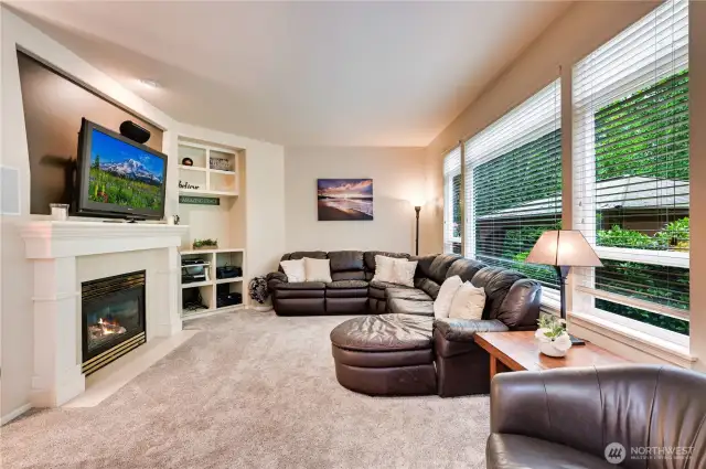 Open Family Room off the kitchen with tons of windows, gas fireplace and built-ins