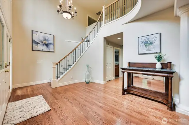 Curved staircase with wrought iron spindles