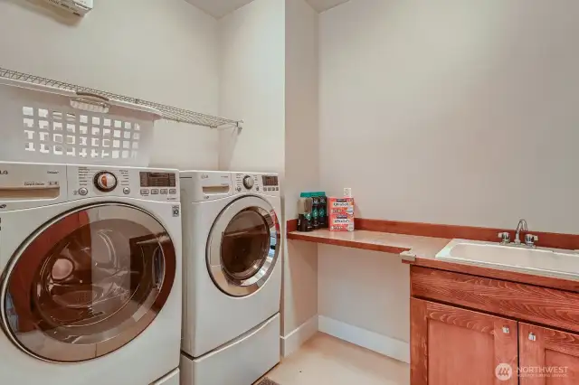 Large upstairs laundry room with sink