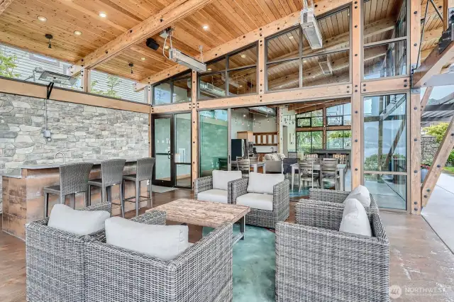 Covered outdoor seating area with gas BBQ, overhead heating, bar area with sink