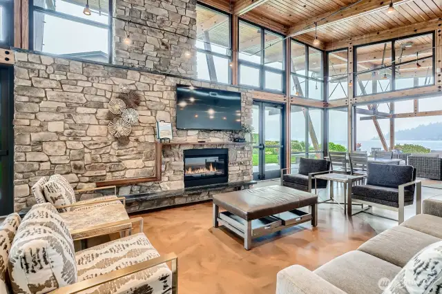Gas fireplace and TV inside waterfront cabana