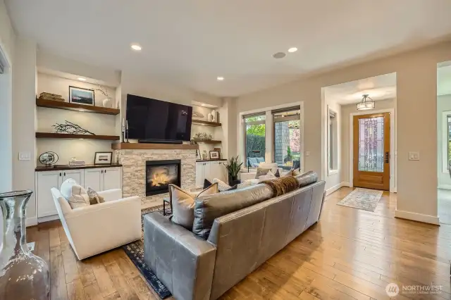 Living room with recently updated custom fireplace and gorgeous built-ins