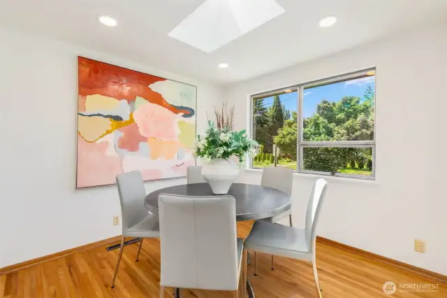 A private cozy dining room with ceiling skylight.