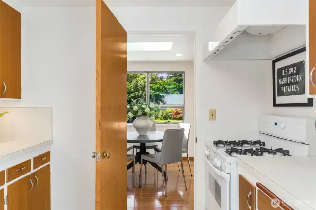 Eat-in galley kitchen with new flooring.