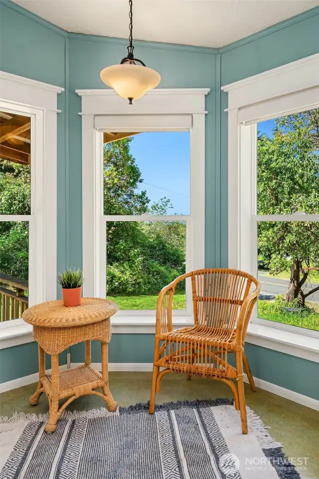 Coffee nook surrounded by windows on three sides.
